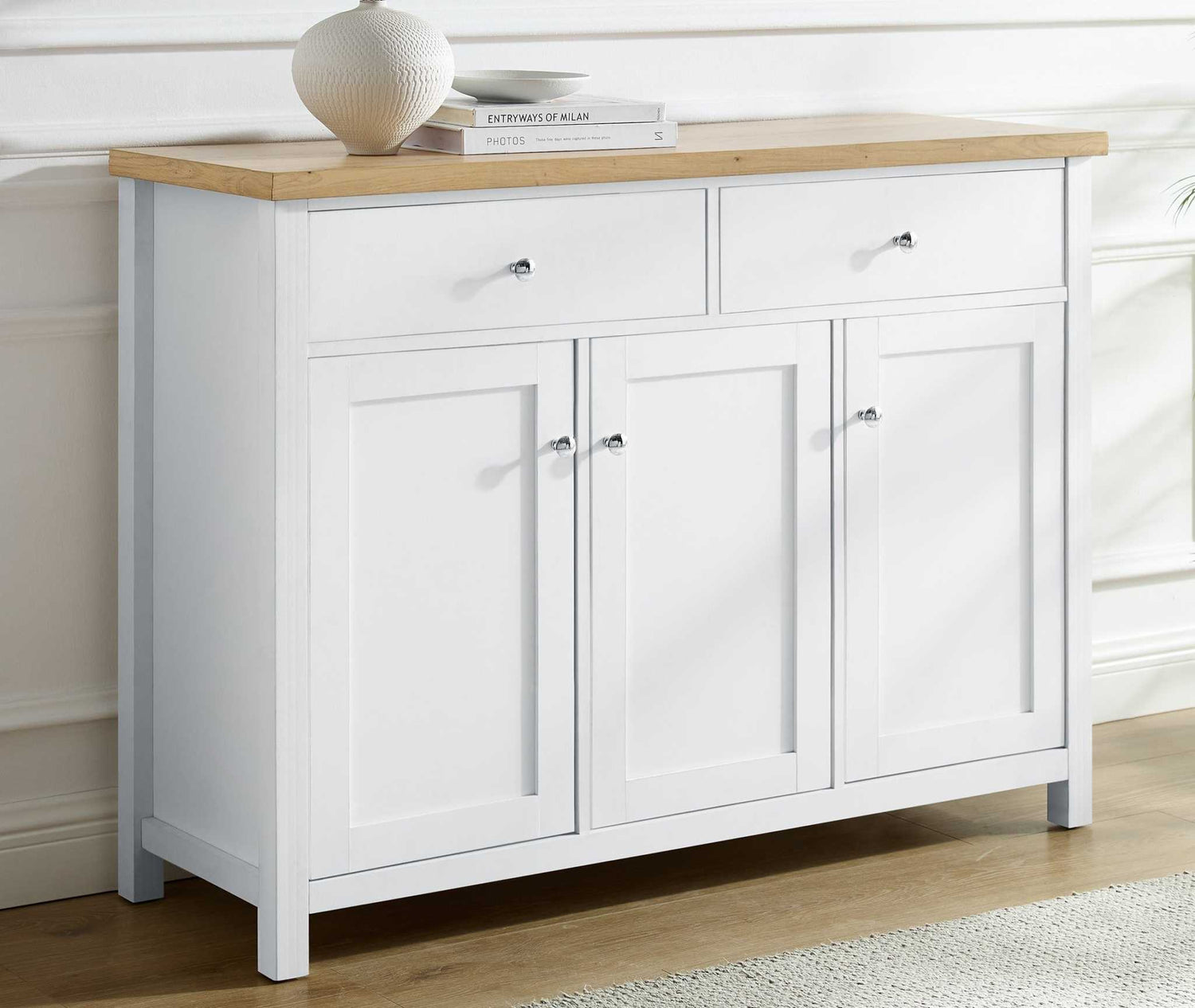 Large sideboard storage cabinet with white base and wooden top, featuring chrome knobs and spacious drawers and cupboards