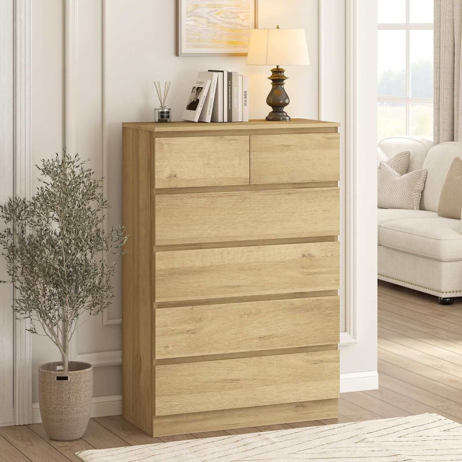 Light oak 6 drawer tallboy dresser in a living room setting with sleek, minimalist design.