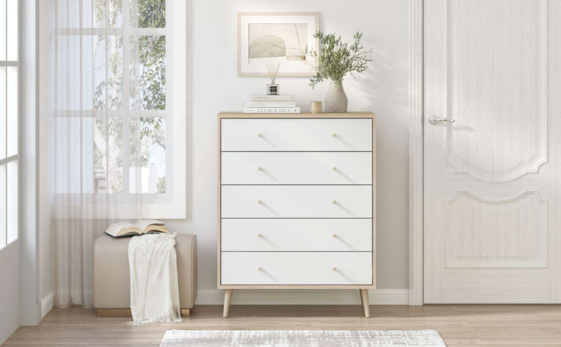 Adriana 5 Drawer chest of drawers with Scandinavian style splayed legs and oak-effect finish in a bright bedroom setting