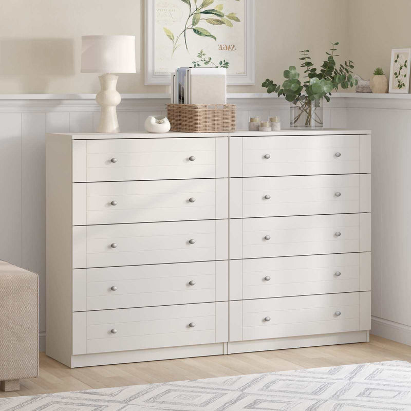 Harriet 5 drawer chest of drawers set for bedroom storage, stylish white dressers in a modern room setting.