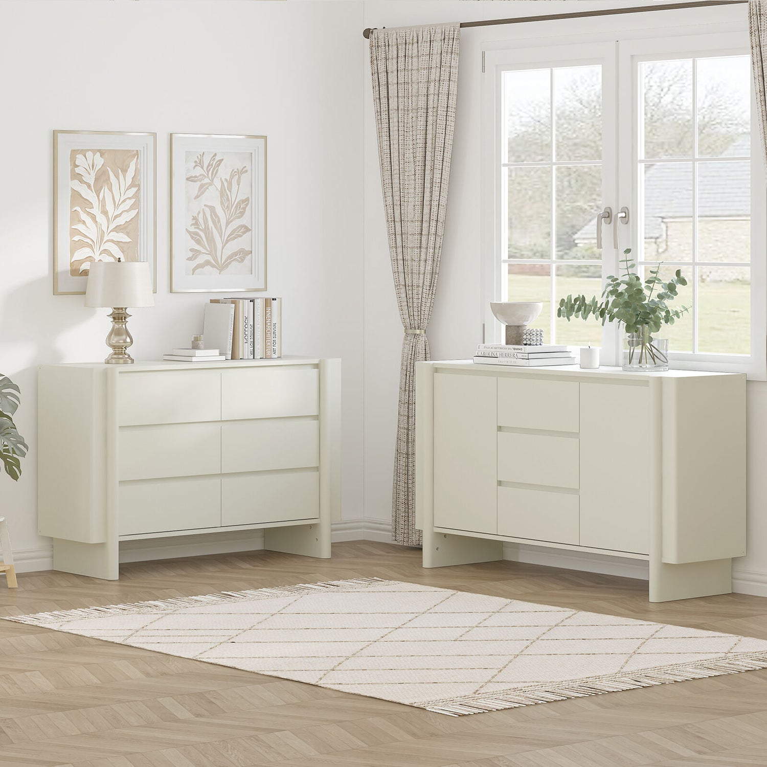 Two white dressers in a room with a window and decor.