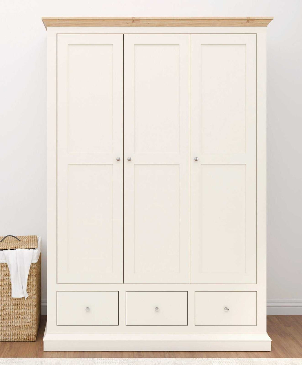 Hannah Wardrobe with cream body, oak top, three doors, and drawers featuring silver knob handles.