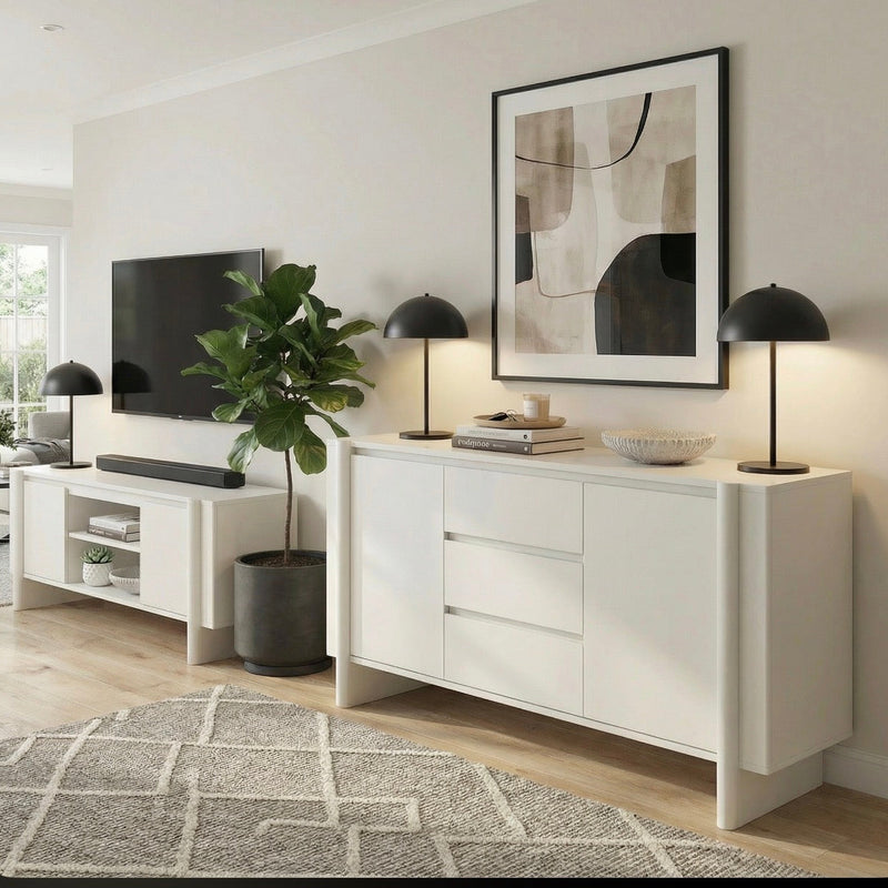 Modern living room with white sideboard, TV, and abstract art