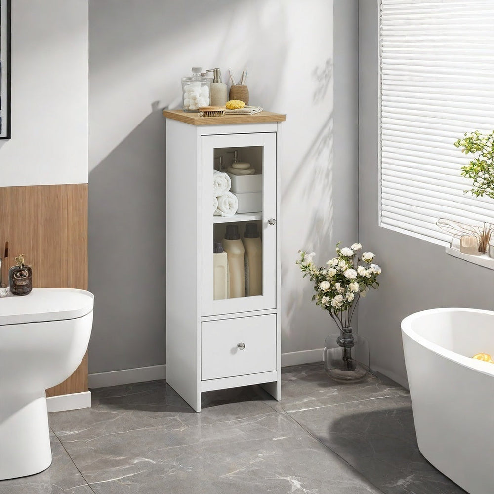 Glass door bathroom cabinet with adjustable shelves and drawer in a modern bathroom setting.