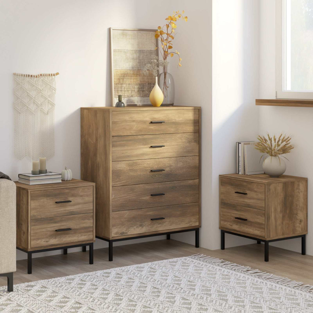 MerryLuk Bronx dresser and nightstand set featuring a natural wood grain finish, sleek metal handles, and industrial metal legs in a stylish bedroom.