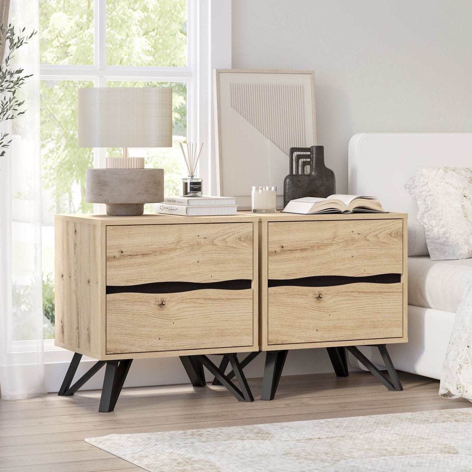 Grayson 2 Drawer Bedside Table Set with faux oak finish and black metal legs in a modern bedroom setting.