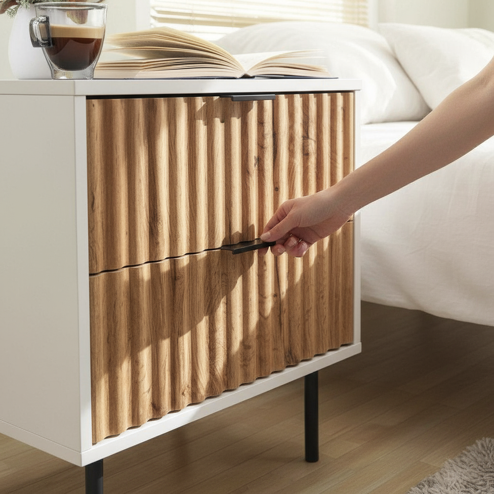 Close-up lifestyle with person and ribbed bedside table