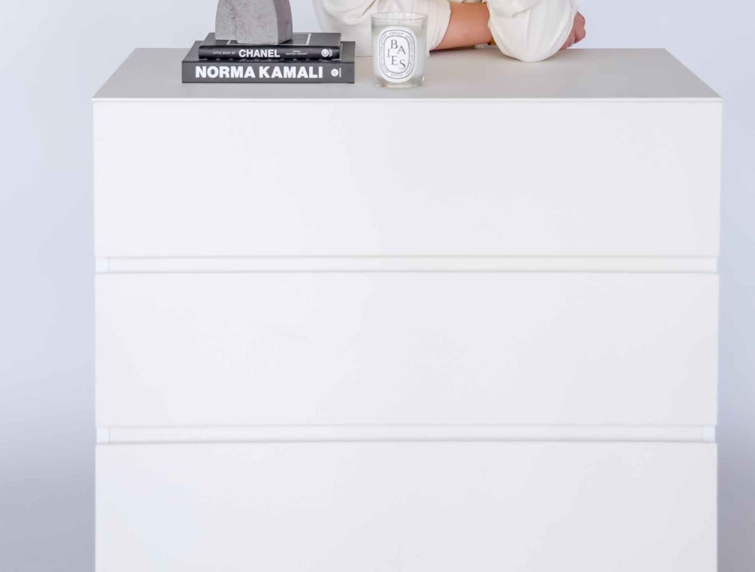 Modern 4 Drawer Dresser with sleek white design and ample storage, suitable for various room settings.