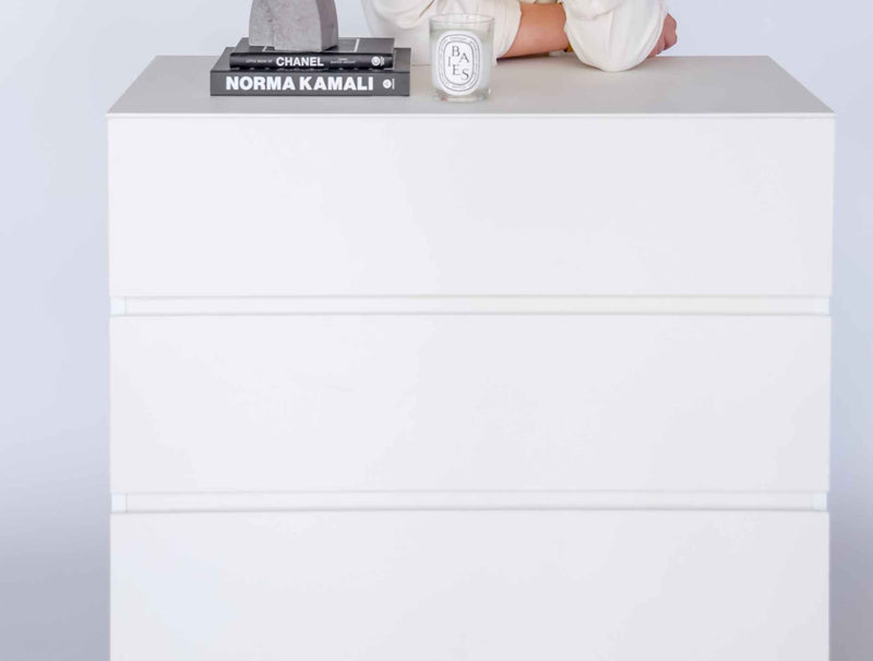 Modern 4 Drawer Dresser with sleek white design and ample storage, suitable for various room settings.
