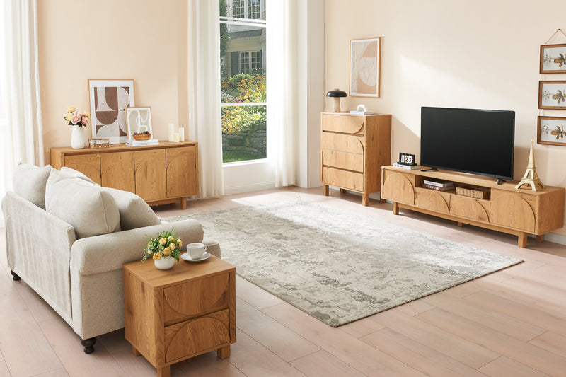Modern living room with beige sofa, wooden side table, and TV stand.